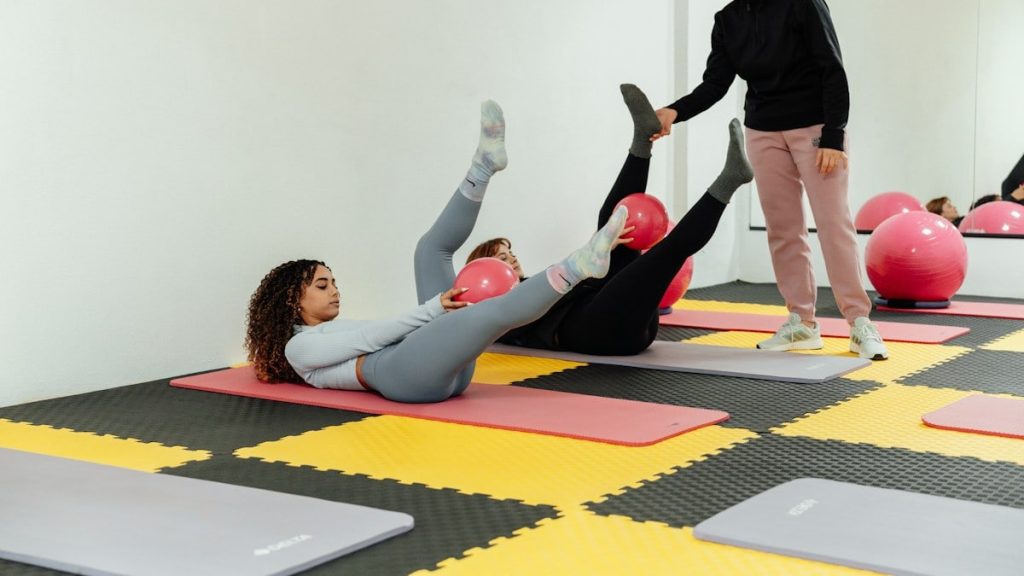 a group of people doing exercises in a gym